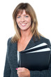 Photo: Corporate executive holding important documents Corporate executive holding important documents