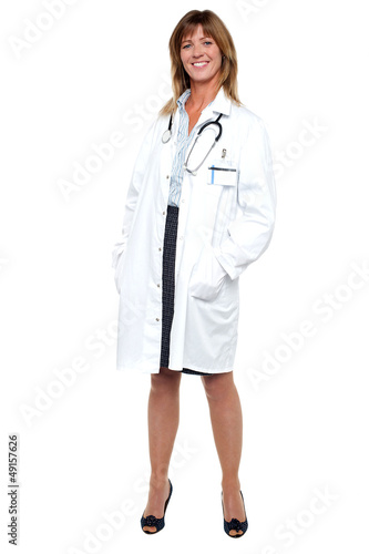 Photo: Smiling middle aged medical expert, full length portrait Smiling middle aged medical expert, full length portrait