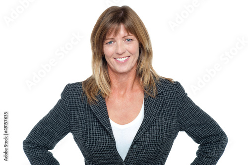 Photo: Business executive with hands on her waist Business executive with hands on her waist