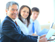Happy business man with colleagues