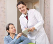 friendly doctor talks with  joyful  woman