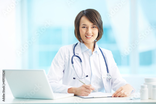 Photo: Physician at workplace Physician at workplace