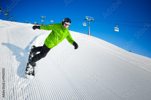 Photo: Snowboarder on pise in high mountains Snowboarder on pise in high mountains