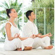 Young Couple Doing Yoga