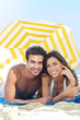 Smiling Couple Enjoying At Beach