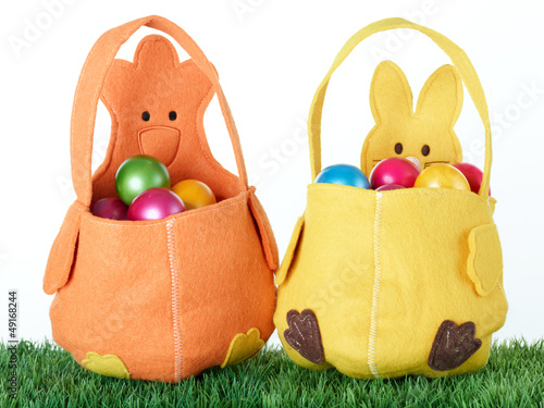 Photo: Colored eggs in two Easter baskets Colored eggs in two Easter baskets