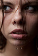 Portrait of a girl's face which water flows