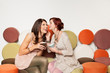 Photo: girls whispering a secret and laughing girls whispering a secret and laughing