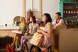 Photo : young people in a cafe staring at something young people in a cafe staring at something