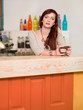 Photo : beautiful caucasian girl in colorful bar beautiful caucasian girl in colorful bar