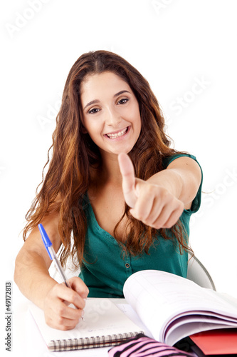 Photo: Portrait of a young happy student doing thumbs up Portrait of a young happy student doing thumbs up