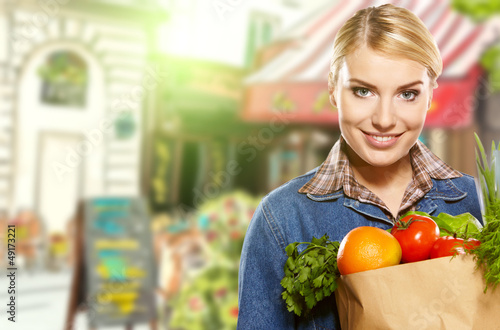 Photo: Woman buying some vegetables Woman buying some vegetables