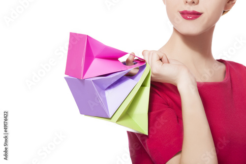 Photo: Women in red dress with little shopping bags Women in red dress with little shopping bags