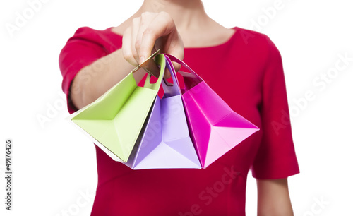 Photo: Women in red dress with little shopping bags Women in red dress with little shopping bags