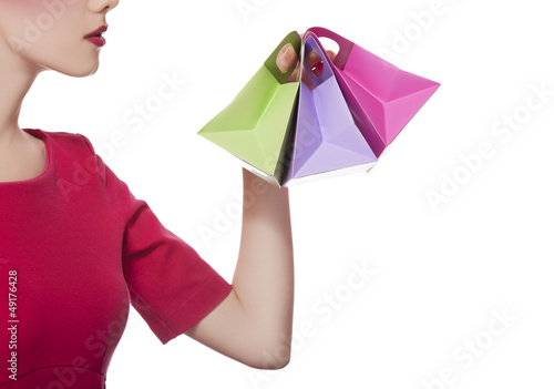 Photo: Women in red dress with little shopping bags Women in red dress with little shopping bags