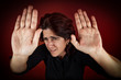 Foto: Frightened woman defending herself Frightened woman defending herself