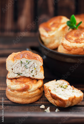Photo: Mini pies with chicken and green onions, selective focus Mini pies with chicken and green onions, selective focus