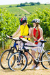 bikers holding a map in vineyard, Czech Republic