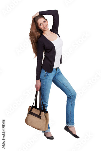 Photo: Girl dressed in stylish blue jeans Girl dressed in stylish blue jeans