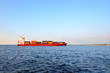 cargo ship sailing in still water