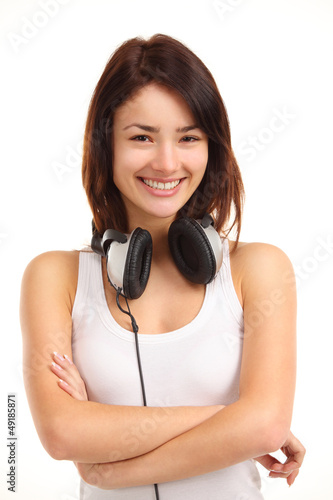Photo: Woman with headphones listening music on player Woman with headphones listening music on player