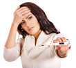 Woman having  flue  taking thermometer.
