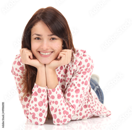 Photo: Portrait of a smiling young woman lying on the floor Portrait of a smiling young woman lying on the floor