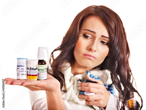 Photo: Woman having pills and tablets. Woman having pills and tablets.
