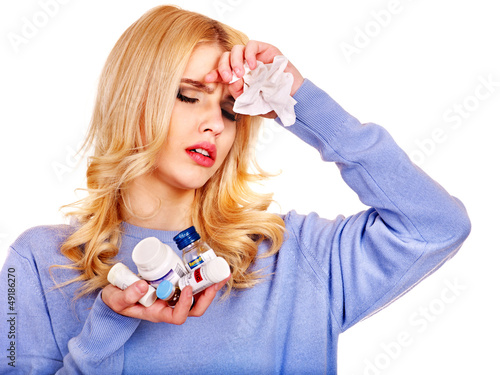 Photo: Young woman having flu takes pills. Young woman having flu takes pills.