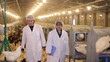 Vet and Farmer on Chicken Farm