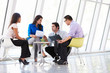 Businesspeople Having Meeting In Modern Office