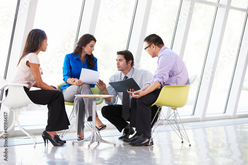 Photo: Businesspeople Having Meeting In Modern Office Businesspeople Having Meeting In Modern Office