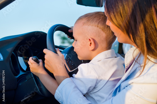 Photo: Small boy learning to drive Small boy learning to drive