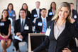 Businesswoman Delivering Presentation At Conference