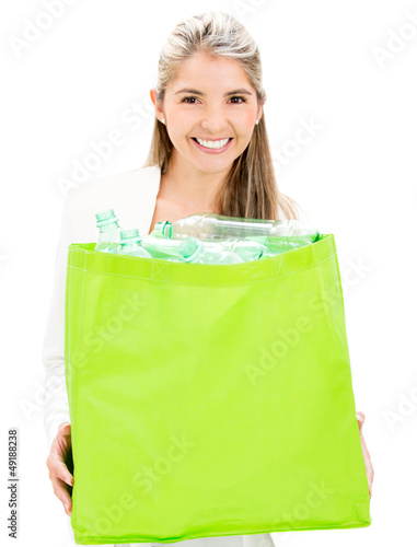 Photo: Woman recycling bottles Woman recycling bottles
