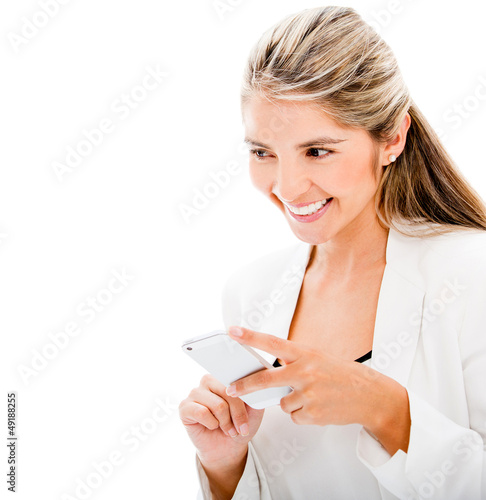 Photo: Woman sending a text message Woman sending a text message