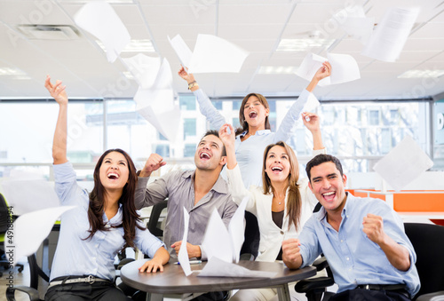 Photo: Business group celebrating a triumph Business group celebrating a triumph