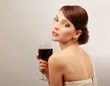 Beautiful brunet girl drinking red wine