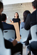 Photo: Businesswoman Delivering Presentation At Conference Businesswoman Delivering Presentation At Conference