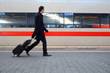 Motion Blur Of A Man Rushing To Catch A Train At A Station