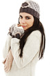 Cute woman wrapped up warm in winter clothes