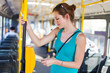 Pretty, young woman on a streetcar/tramway