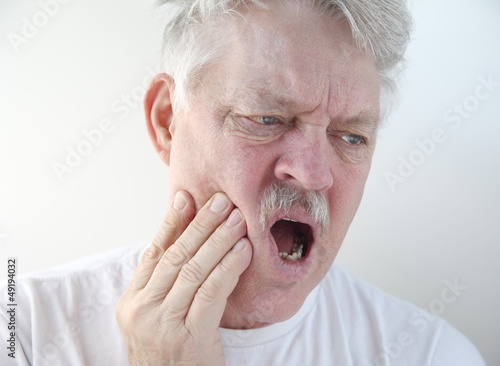 Photo: man with pain in cheek man with pain in cheek