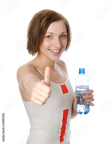Photo: young woman drinking clear water. Isolated over white young woman drinking clear water. Isolated over white