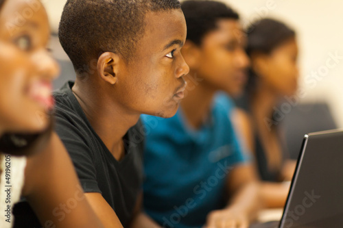 Photo: group of african american college students in lecture room group of african american college students in lecture room