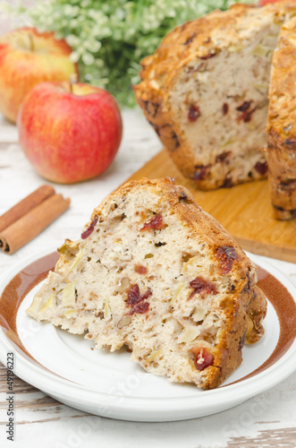 Photo: piece of homemade apple cake with cinnamon and dried cranberries piece of homemade apple cake with cinnamon and dried cranberries