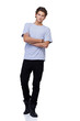 Handsome young guy standing against a white background with his 