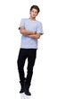 Handsome young guy standing against a white background with his 