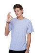 Young guy giving the OK-sign while smiling against a white backg