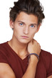 Serious looking young guy against a white background - Cropped